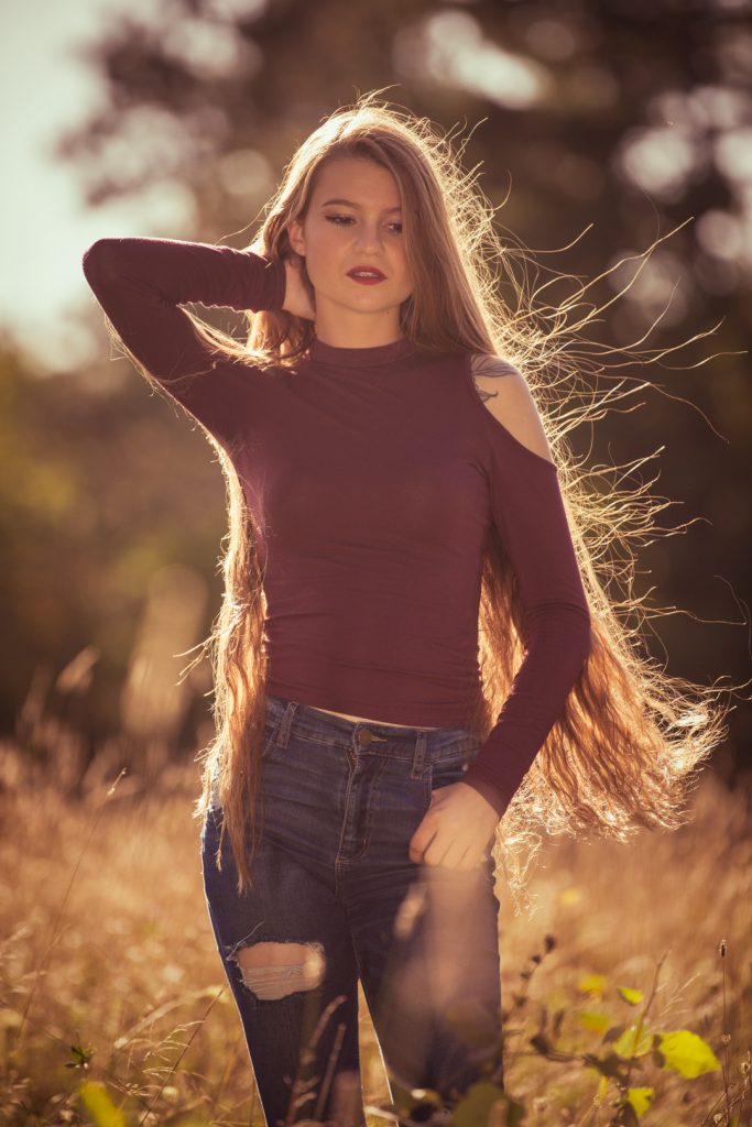 Model with very long hair in sunset