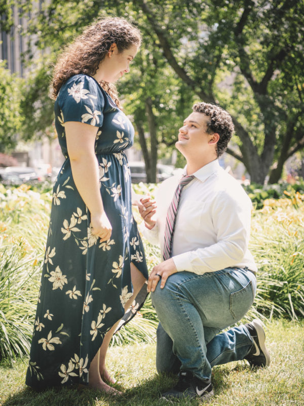 Gentlemen proposing to his future wife outdoors