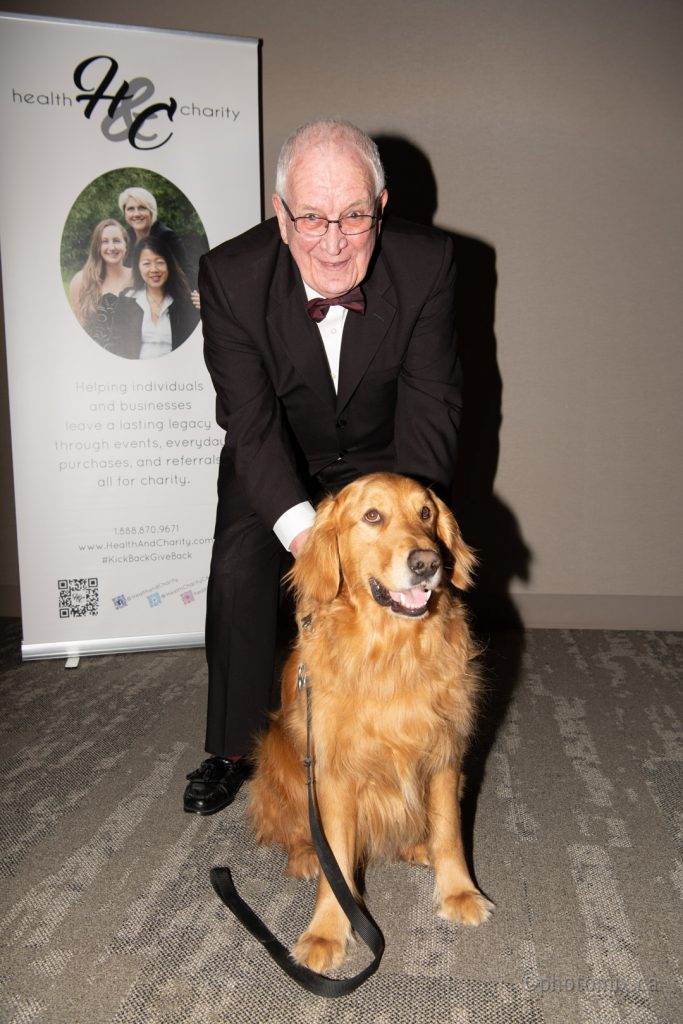 Dr. T. and his dog at a charity event