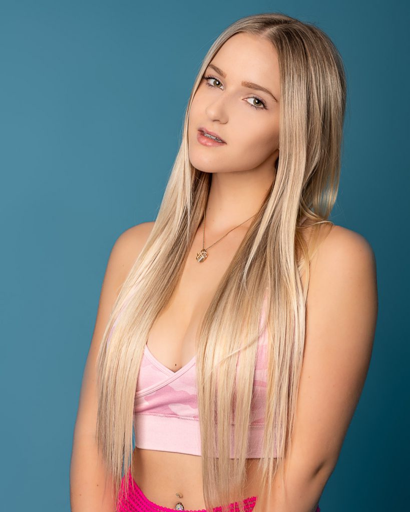 Blond hair and blue background in studio