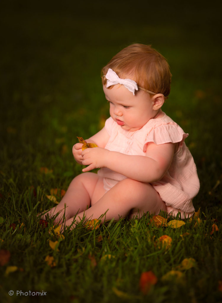 Beautiful baby outdoors in fall