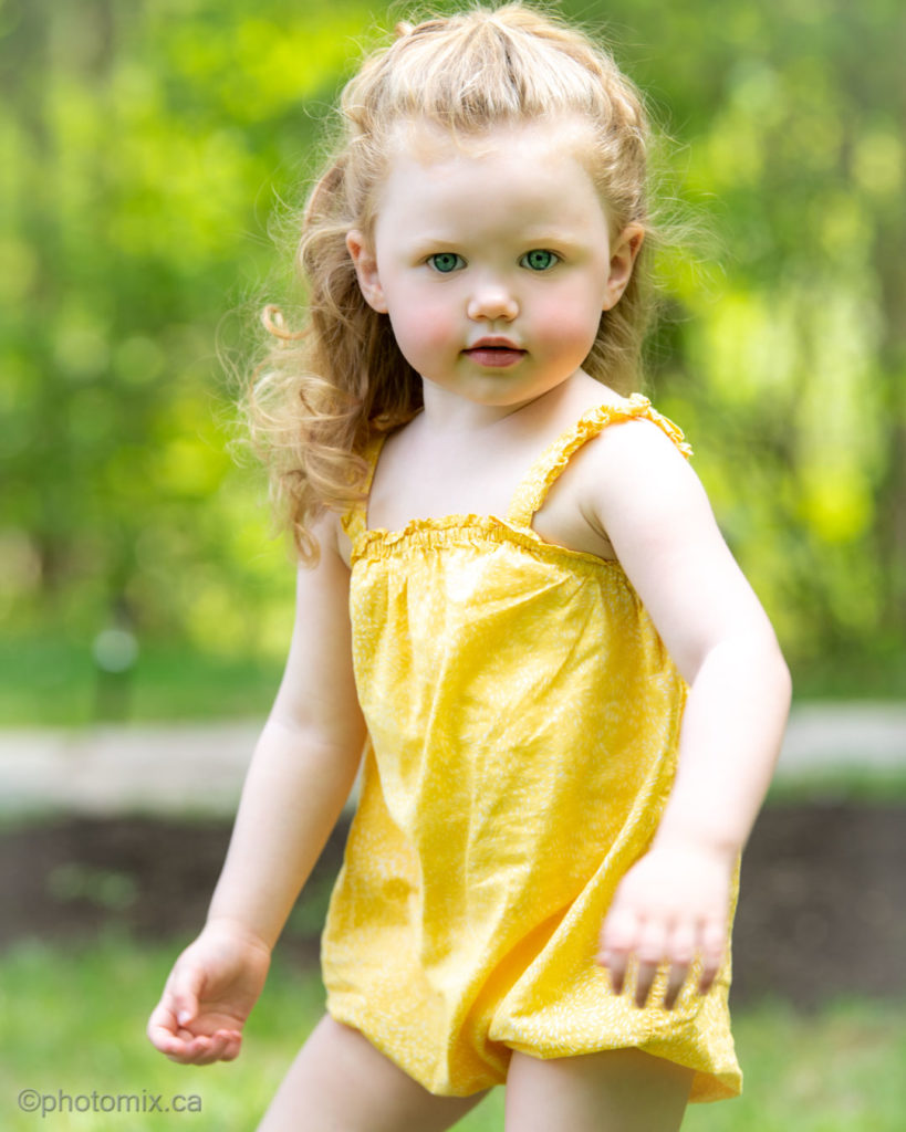 Young child outdoors with blue eyes