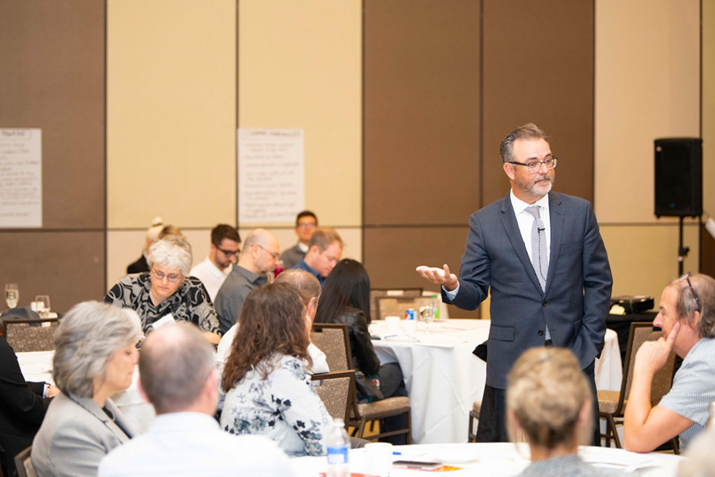 Ken Miller speaking at a conference